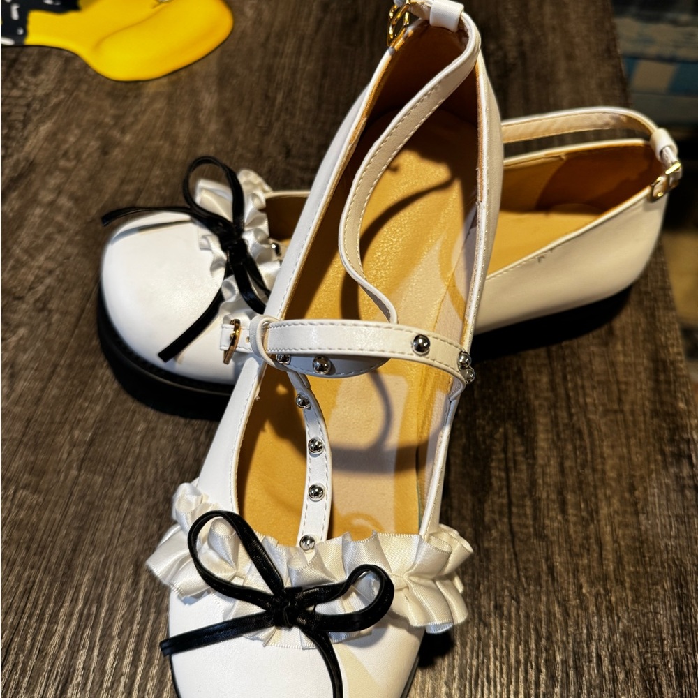 Elegant White Women's Shoes with Black Accents